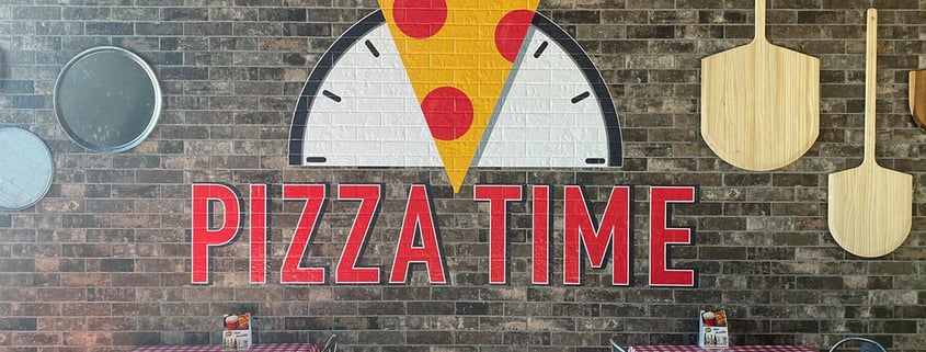 Printed wall graphics for Pizza Time at the Odysea Aquarium.