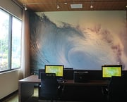 Large wall graphic behind several desks