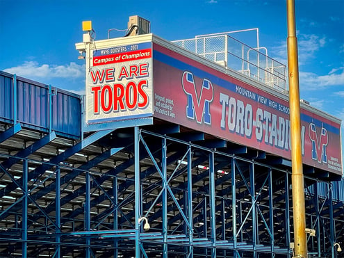 Large signage on stadium box at a high school