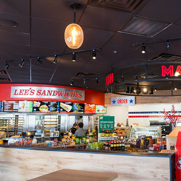 Photo of Lee's Sandwiches with large signage above.