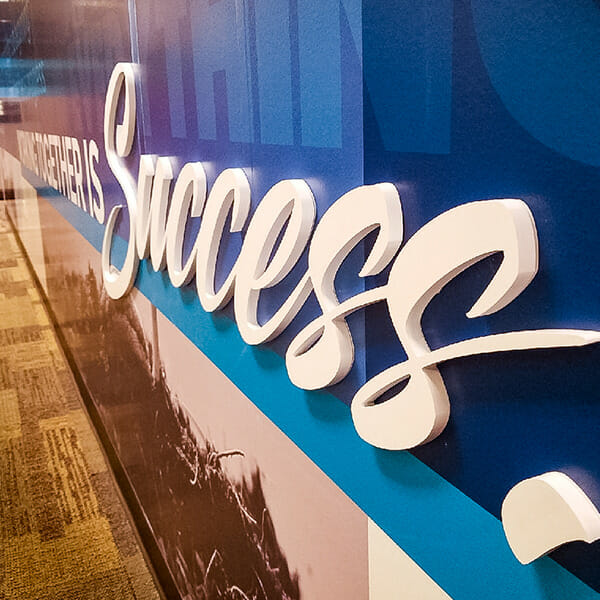 Color wall graphics signage printed in relief.