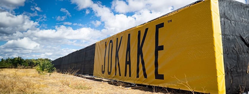 Construction fence banner wrap for Jokake Construction Company.