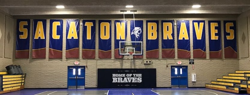 Gymnasium school banners for the Sacaton Braves.