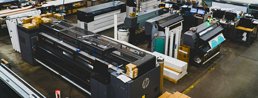 picture showcasing wide format commercial printers latex operations roll-2-roll production