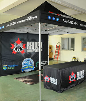 Printed trade show shade tent with backdrop banner.