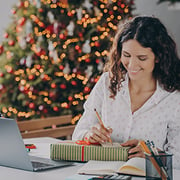 Woman at a desk with a Christmas present