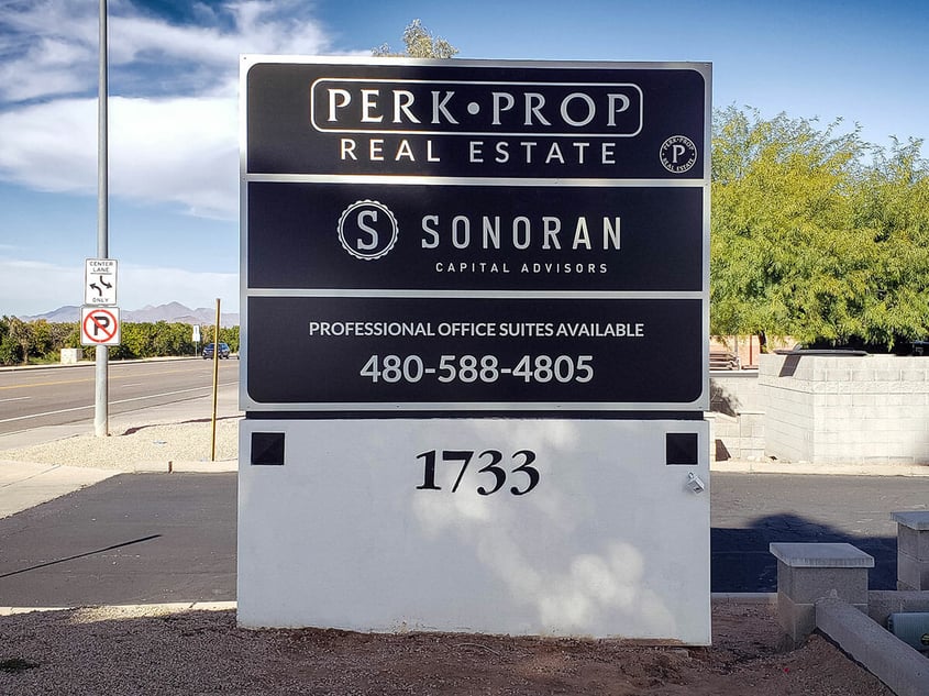 Example of a monument sign panel replacement for a real estate company.