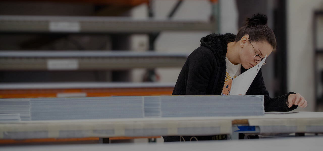 A Print Finishing woman working on a project