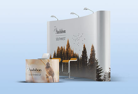 Curved trade show display and counter display for Audubon Southwest.