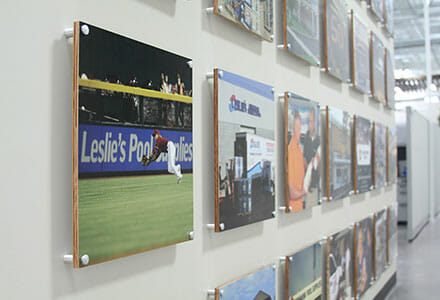 Printed MDO square material with standoffs displayed on a wall for Leslie's Pool Supplies.