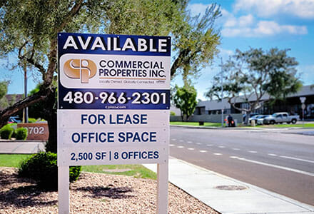 Commercial real estate property sign displaying leasing office space.