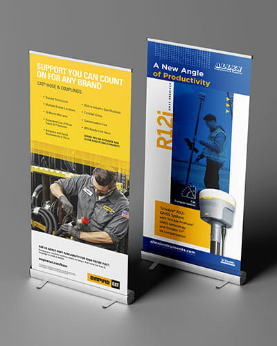 Retractable banners displaying new products and services from Empire Cat.