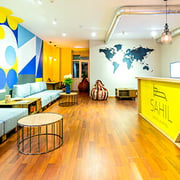 Colorful printed wall graphics in the waiting area of an office.