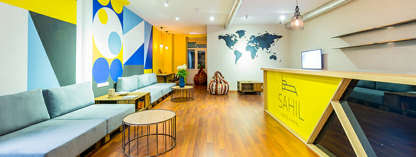 Colorful printed wall graphics on the reception area of a modern office.