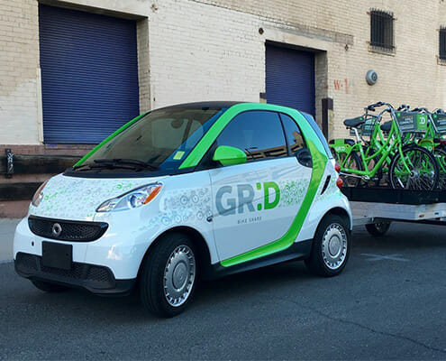 Full wrap vinyl graphics for Grid smart car and bicycles