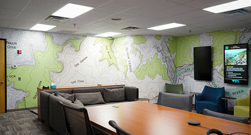 Boardroom with full wall coverings on 2 walls.