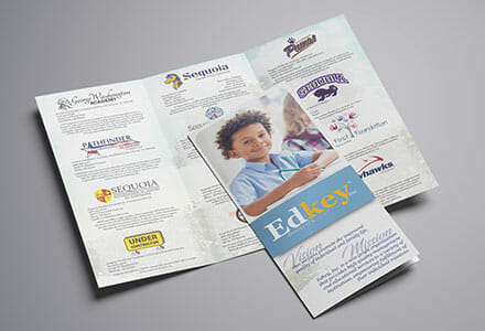 Trifold brochure for a school with a smiling child on the front cover.