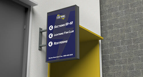 Wayfinding signage for directional information at a hockey stadium.