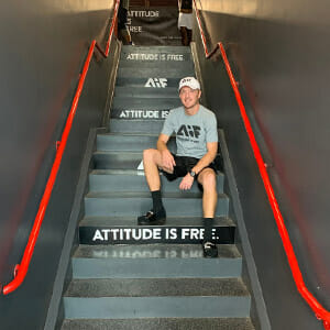 Stair riser graphics with man sitting on the stairs for Attitude Is Free