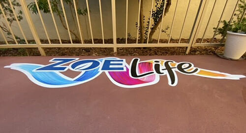 Alumigraphics floor decal of the Zoe Life logo for Glencroft