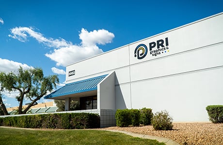 Exterior photo of the front entrance to PRI Graphics & Signs.
