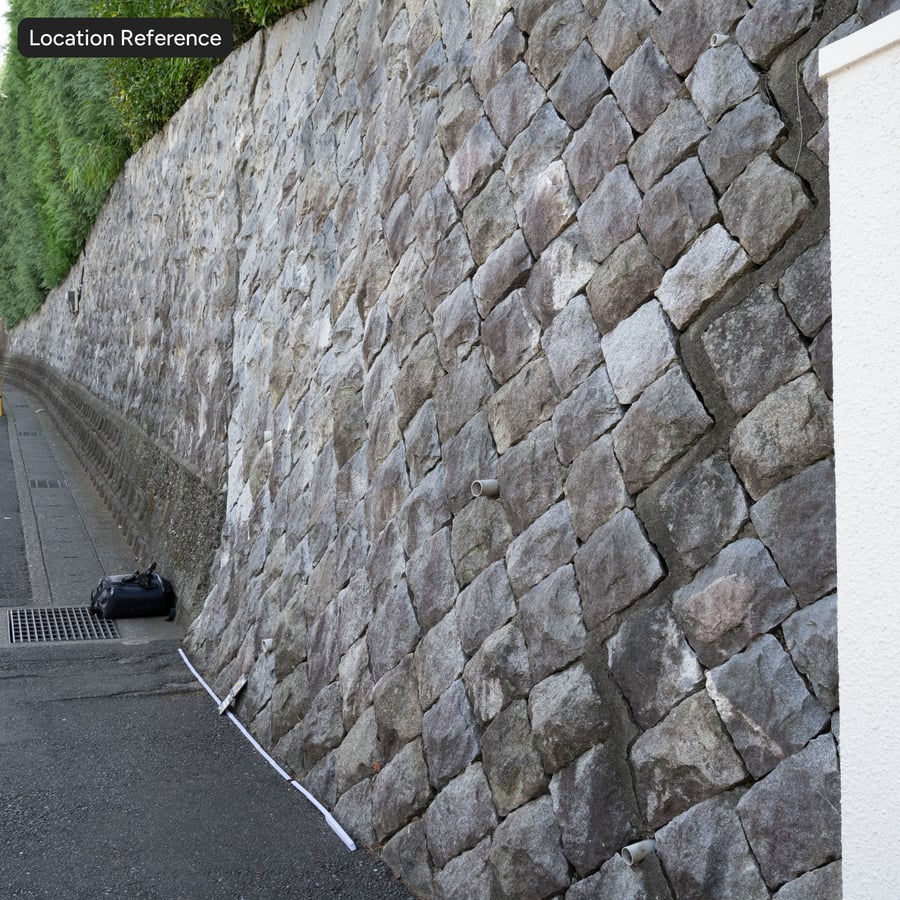 Textura de muro de contenção diagonal em pedra, cinzento