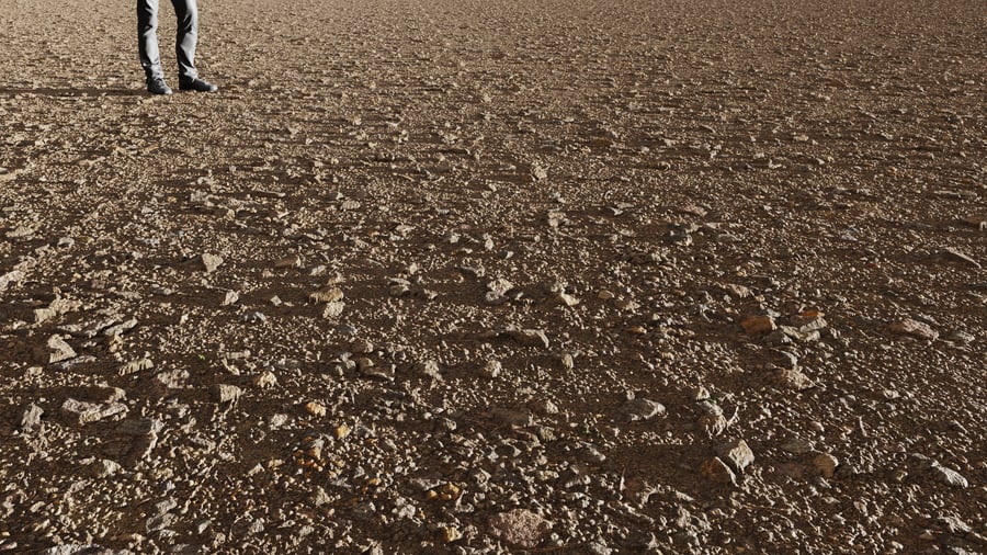 Rocha irregular espalhada sobre textura de terra
