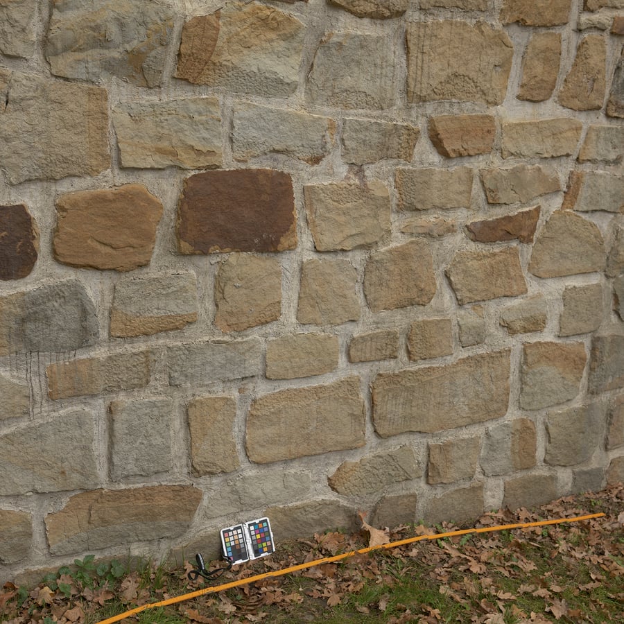 Textura de parede de pedra de escombros com fugas antigas