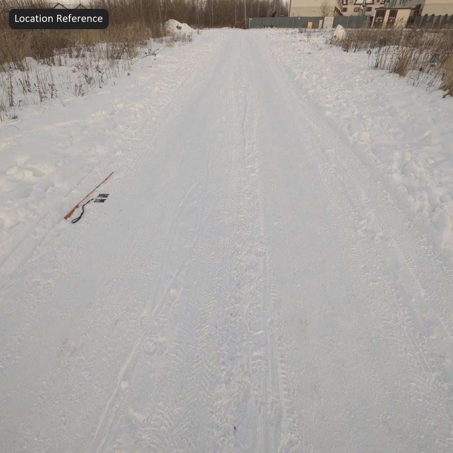 Däckspår på snöig väg Textur