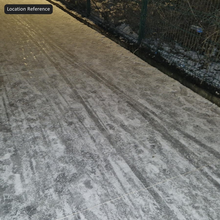 Tire Marks on Snowy Asphalt Texture