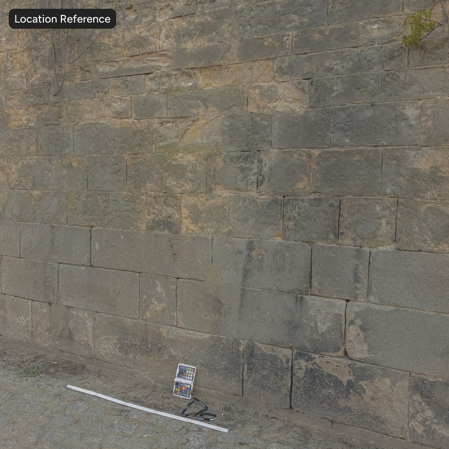 Texture d'un mur en blocs de pierre à liant épaufré