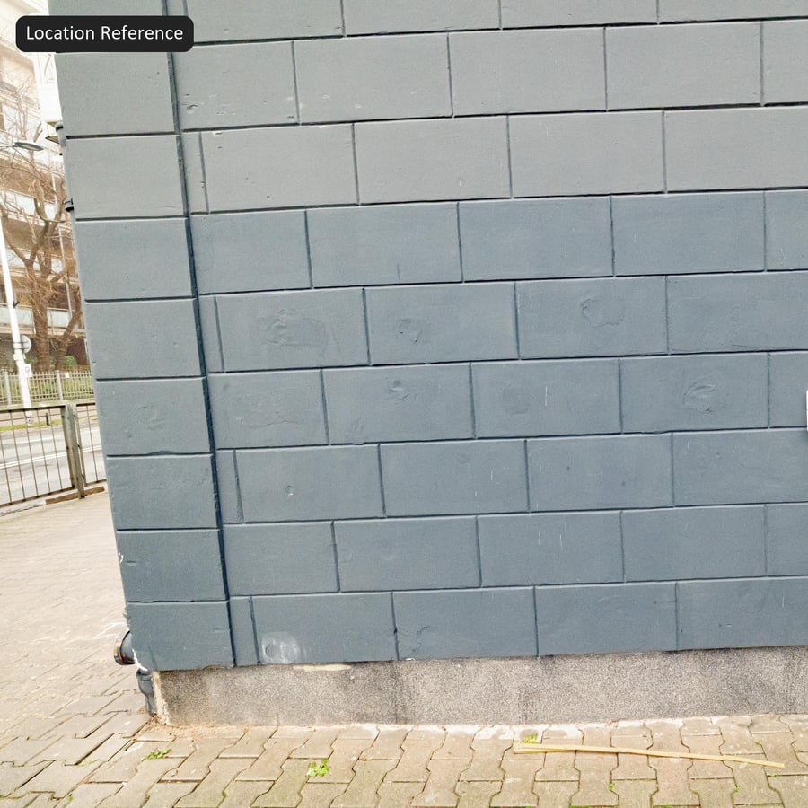 Geverfde betonblokken muurtextuur in halfsteensverband, blauwgrijs