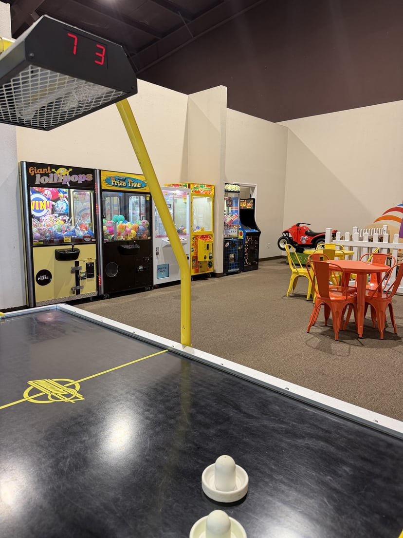 Arcade claw machine stocked with prizes at Central Arkansas Inflatables Indoor Park in Bryant, AR