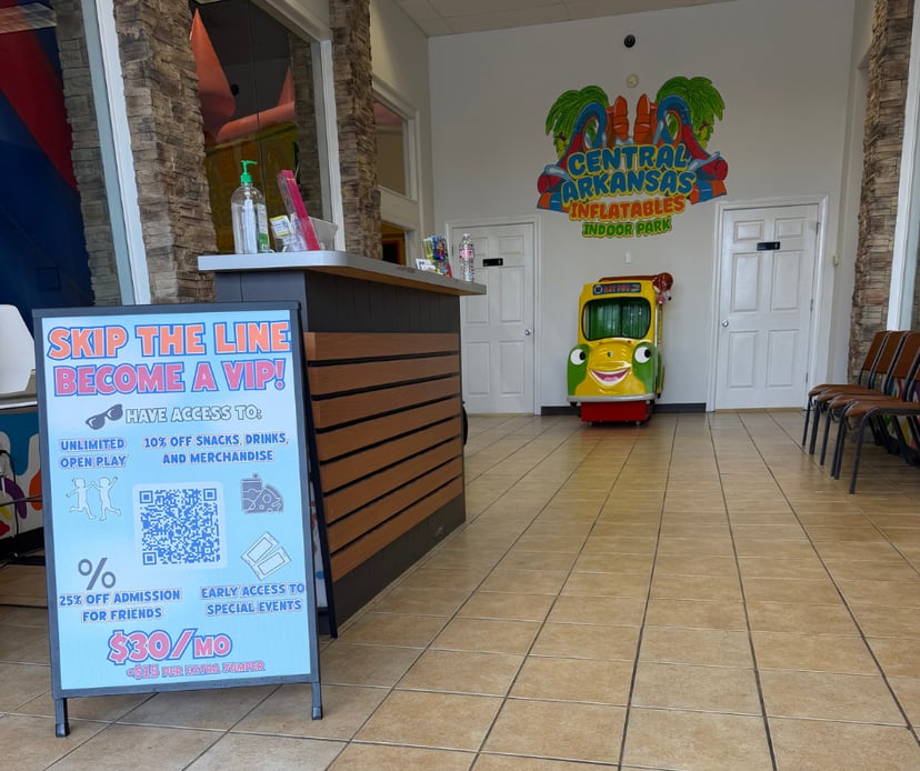 Front lobby and check-in desk welcoming families to Central Arkansas Inflatables Indoor Park