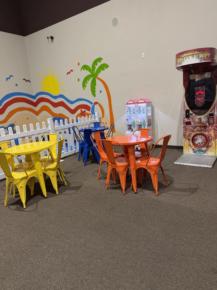 Bright, freshly set up toddler soft play area with padded climbing shapes and a slide at Central Arkansas Inflatables in Bryant, AR