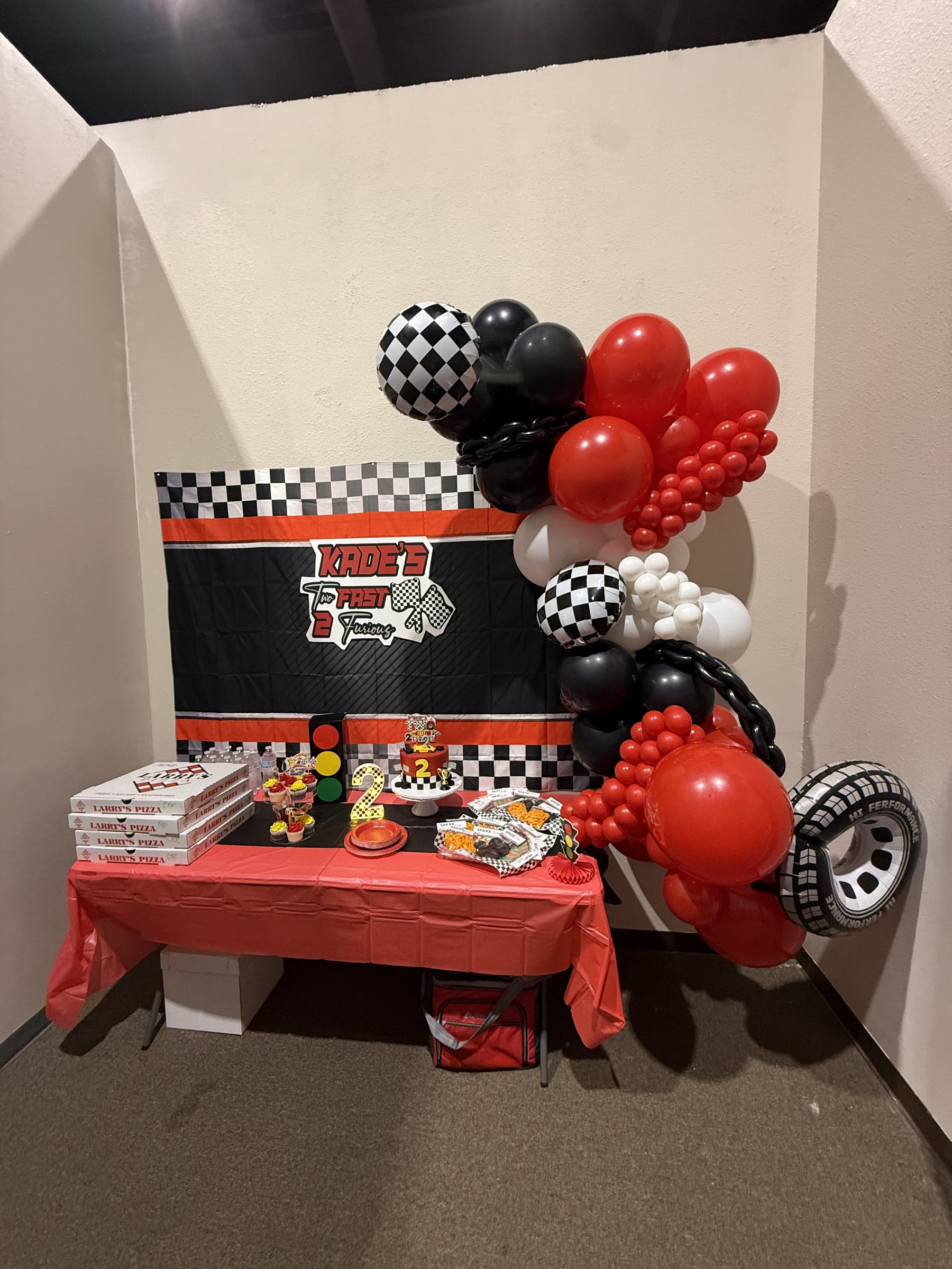 Race car themed birthday party room set up at Central Arkansas Inflatables in Bryant, AR