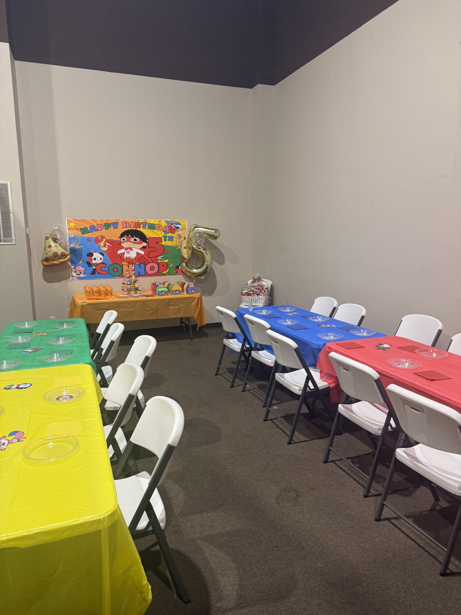 Orange superhero themed birthday party room decorations