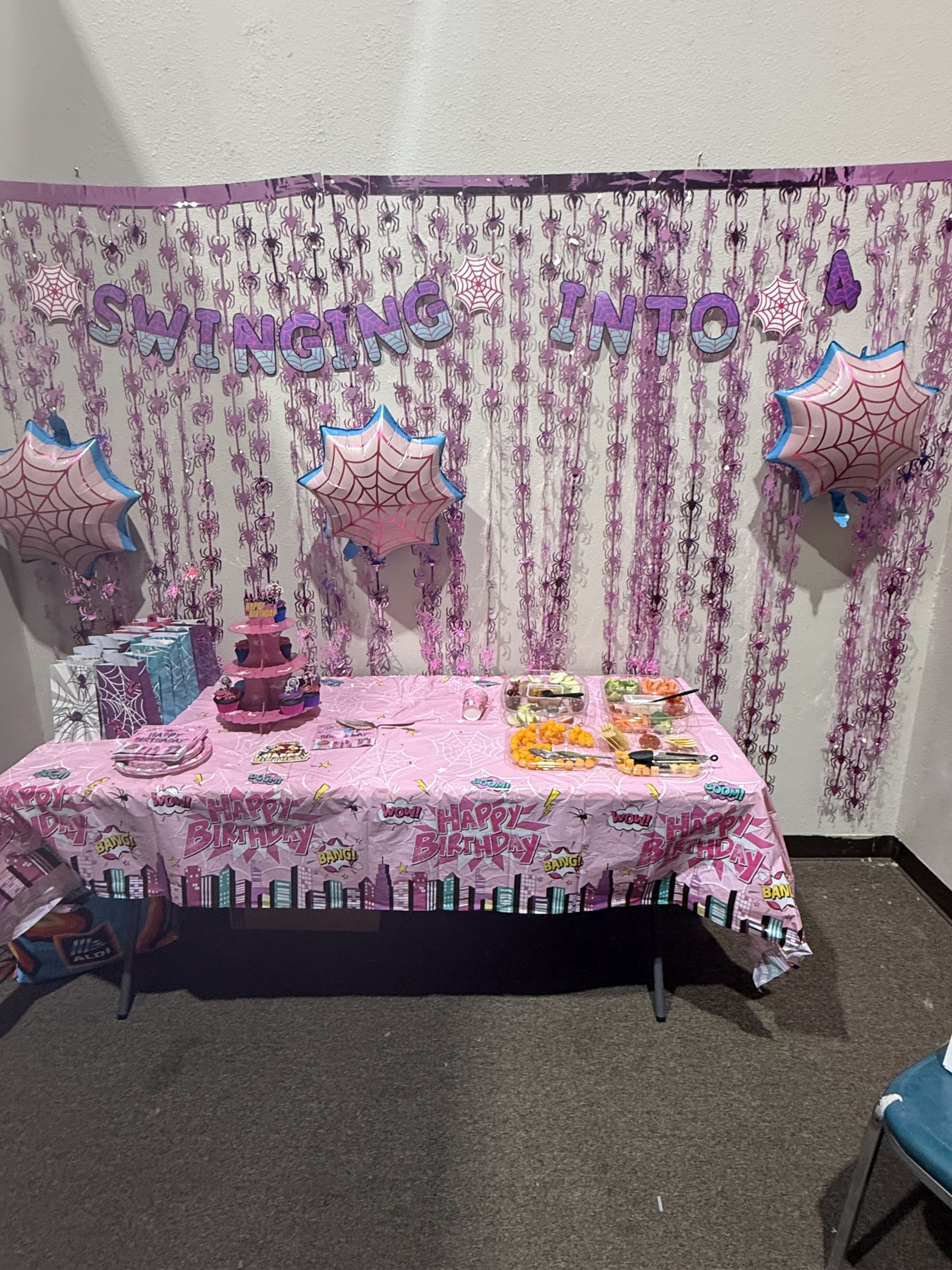 Unicorn and rainbow fringe backdrop for a kids birthday party