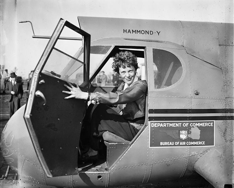 Woman in airplane cockpit, historical photo