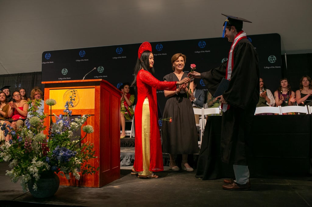 Graduation ceremony with students and faculty.