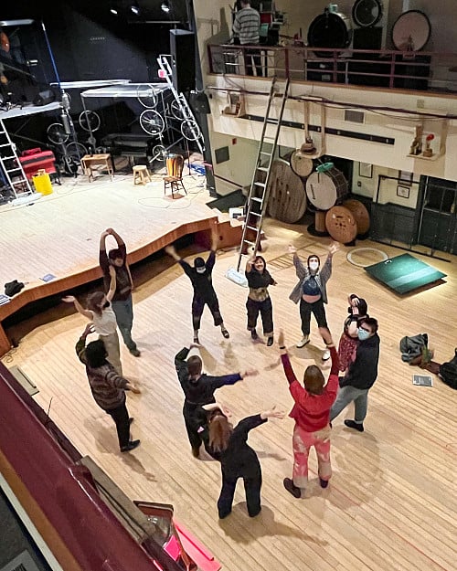 Group of people practicing in theater