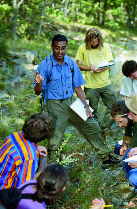 group of students and faculty in the field