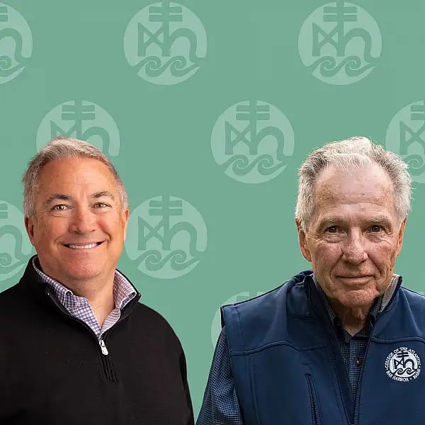 Two individuals against a green background.