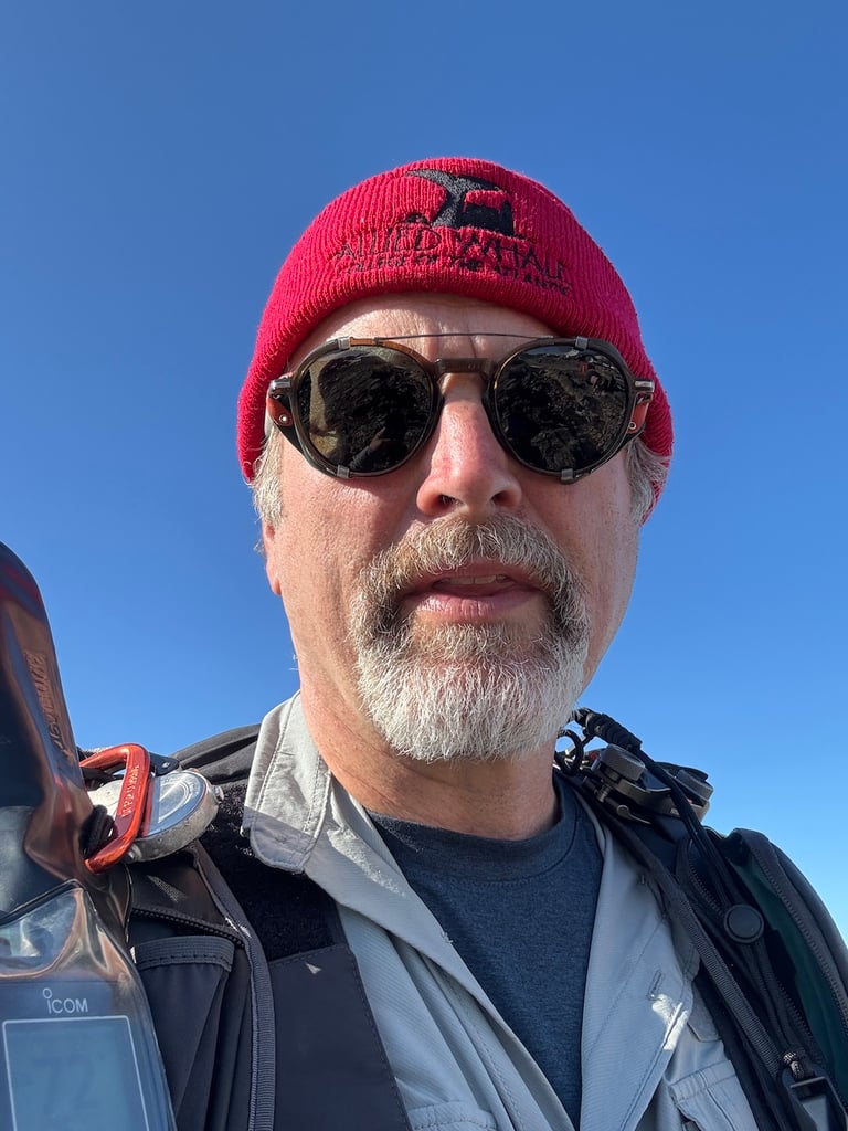 Man wearing sunglasses and red beanie