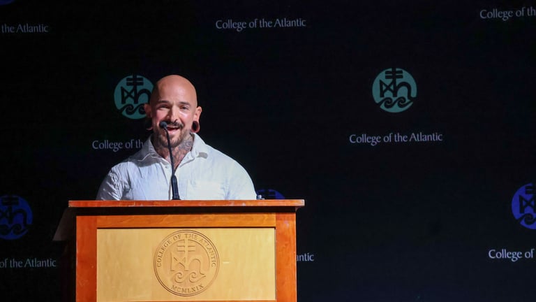 Man speaking at podium event