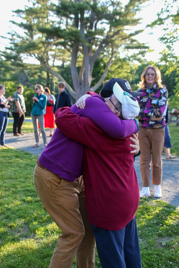people hugging each other