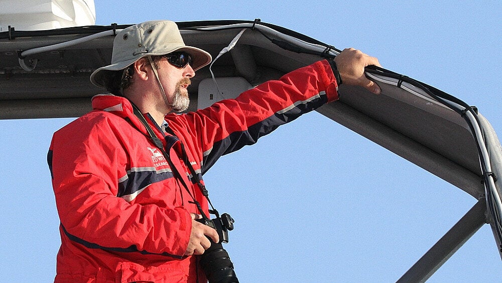 Person on boat with camera