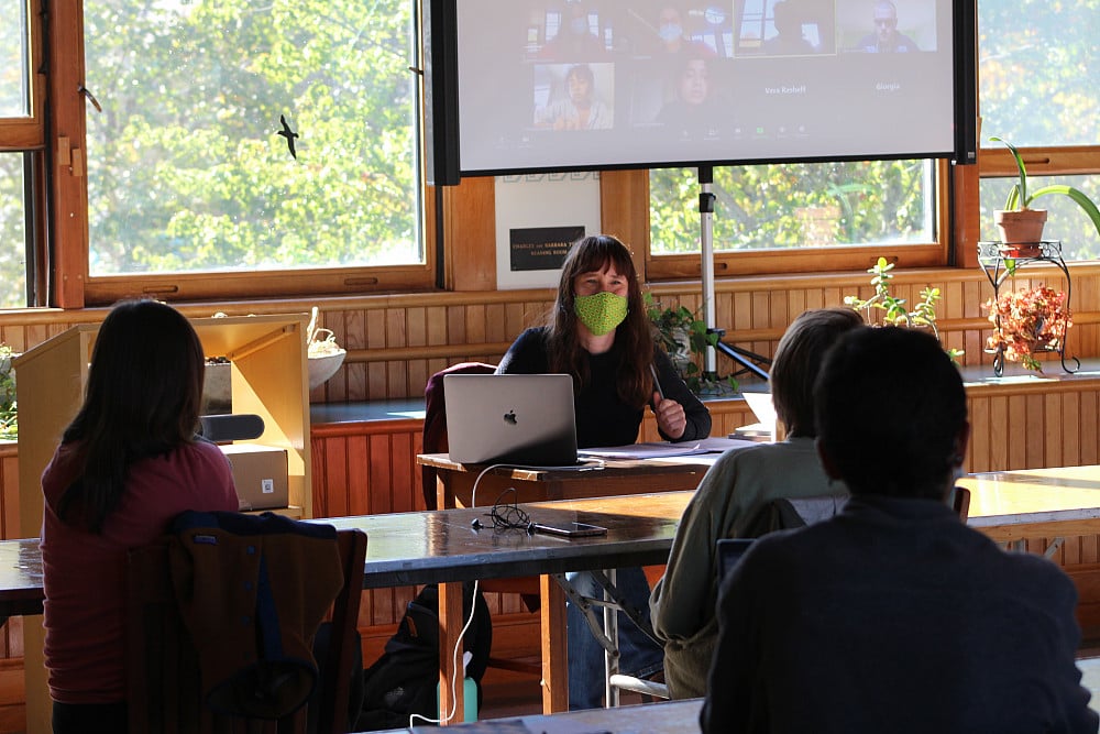Classroom setting with virtual presentation.