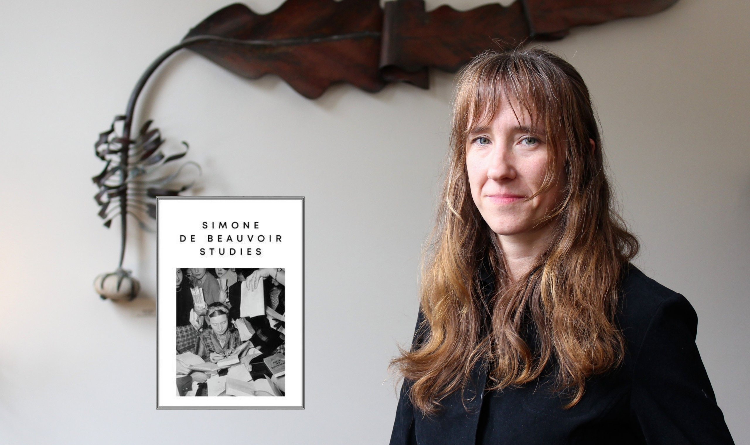 Woman beside artwork and book cover