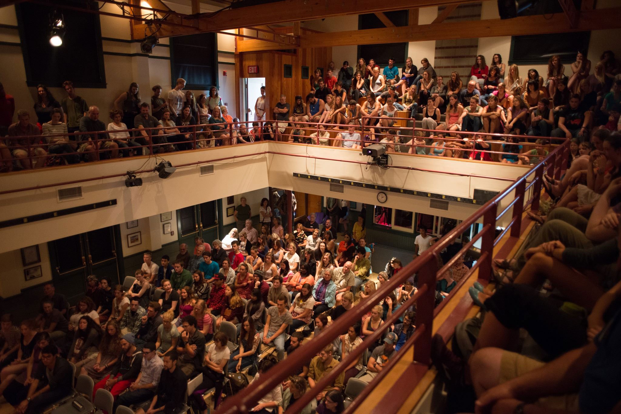 Crowded auditorium filled with people.